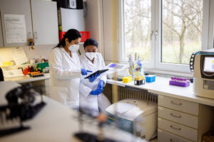 Researchers working on medicine development in a lab