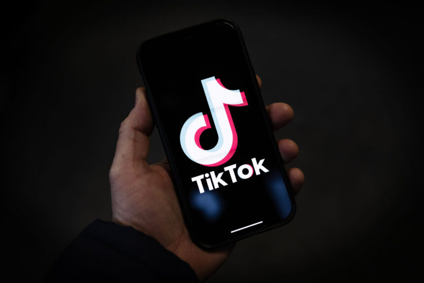 In this photo illustration, a TikTok logo is displayed on an iPhone on February 28, 2023 in London, England. This week, the US government and European Union's parliament have announced bans on installing the popular social media app on staff devices. (Photo by Dan Kitwood/Getty Images)