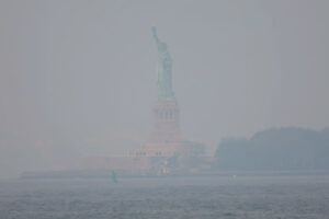 NEW YORK, NEW YORK - JUNE 08: The Statue of Liberty is seen amid hazy conditions due to smoke from the Canadian wildfires on June 08, 2023 in New York City. People in the city and other areas are expected to have another day of bad air Thursday due to smoke from the Canadian wildfires. Air quality advisories continue to be in place for all five boroughs of the city of more than 8 million people. (Photo by Michael M. Santiago/Getty Images)