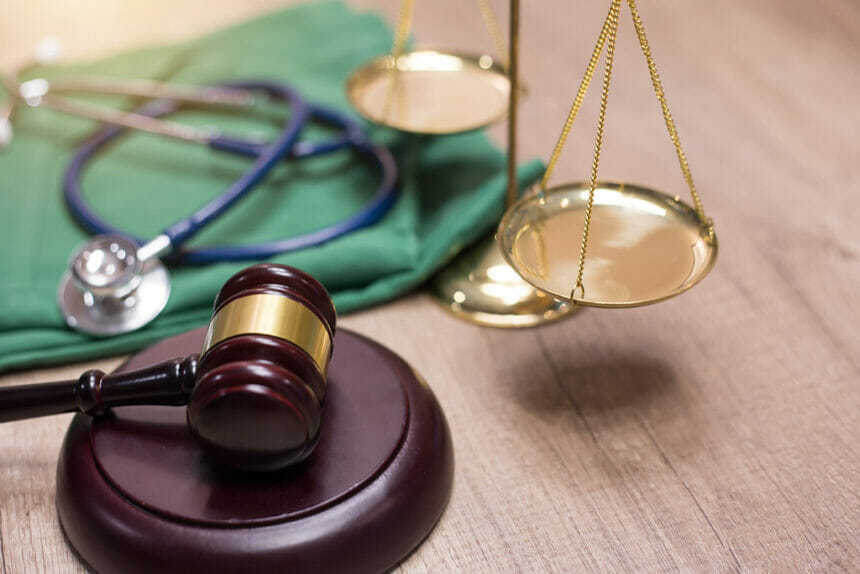 Gavel and stethoscope in background. Medical laws and legal concept.