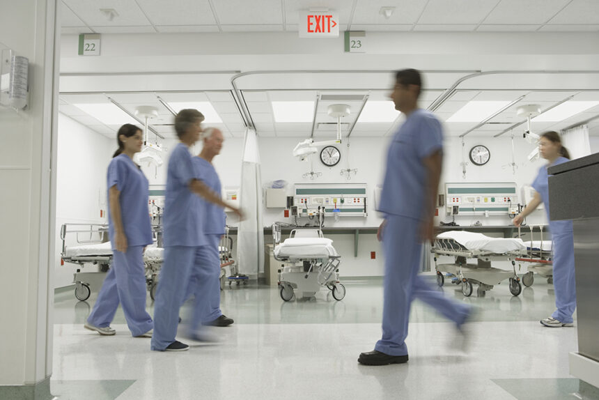 Blurred motion shot of nurses walking in hospital