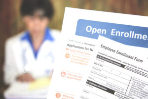 Open enrollment healthcare forms and medical doctor.