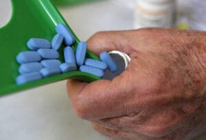 A pharmacist pours pills of Truvada, a PrEP medication, into a bottle. A proposed federal policy aims to protect older Americans from contracting HIV by offering free preventive medication, the latest effort to catch up to much of Europe and Africa in stemming the spread of the virus.