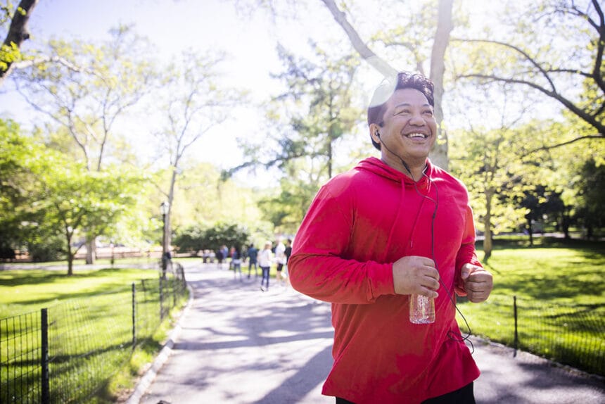 Mature Hispanic Man Jogging in Central Park