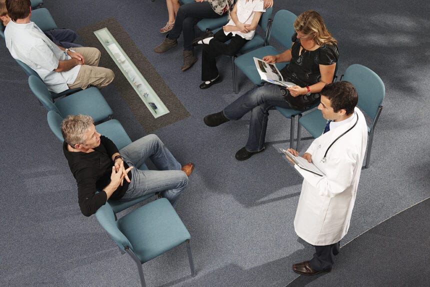 Doctor and patients in waiting area