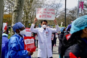 Public health workers, doctors and nurses protest over lack of sick pay and personal protective equipment (PPE) outside a hospital in the borough of the Bronx on April 17, 2020 in New York, NY.