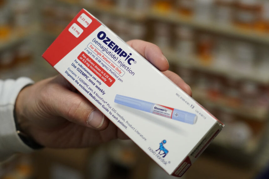 Pharmacist holding Ozempic