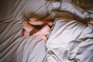 Stock art illustrating a couple in bed