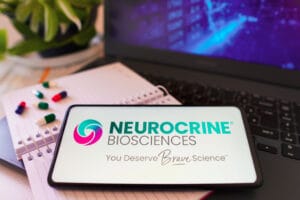 In this photo illustration, the Neurocrine Biosciences logo